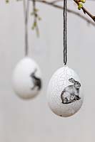 Hanging Easter eggs with printed rabbit embellishment.  