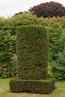 Clipped yew topiary pillar, Scampston Hall, North Yorkshire, UK