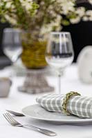 Table setting with napkin rings decorated with catkins