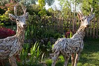 Driftwood deer sculptures by James Doran-Webb,  'From Over the Fence' garden, RHS Malvern Spring Festival 2018.