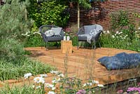Woven Willow fence enclosing Oak decking with outdoor seating - Raised by Rivers, RHS Tatton Park Flower Show 2018
