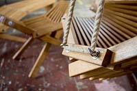 close-up details of hanging chair in workshop of Chris Punch, garden furniture designer.  