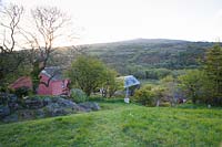 The Magic Garden with views across the house and garden to Garn Fawr and surrounding landscape.