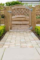 Mixed paving and wooden gate