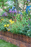 Mixed colourful planting in The British Council Garden - India: A Billion Dreams. Sponser: British Council, RHS Chelsea Flower Show, 2018.

