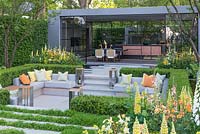 LG Eco-City Garden - Contemporary seating area with sunken courtyard, edged in beds of Lupins, Foxgloves, Aquilegia and Geum - Sponsor: LG Electronics - RHS Chelsea Flower Show 2018
