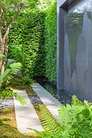 Modern pavillion with water rill, wall engraving, Moss balls and Ferns - LG Eco-City Garden - Sponsor: LG Electronics - RHS Chelsea Flower Show 2018