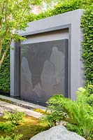 Modern pavillion with water rill, wall engraving, moss balls and ferns - The LG Eco-City Garden, Sponsor LG Electronics, RHS Chelsea Flower Show, 2018.