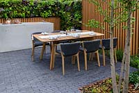 Outdoor cooker, edible living wall and table and chairs. Urban Flow garden, Sponsor: Thames Water, RHS Chelsea Flower Show, 2018.