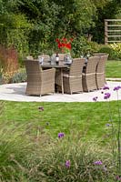 Outside dining table on circular lawn
