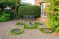 Knot garden replanted with Euonymus japonicus 'Microphyllus' - Shropshire, UK