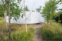Glade of 85 silver birch trees with a simple circular poustinia at its centre, 
a place to pray.