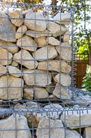 Retaining gabion wall of pale stones