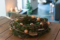 View of festive seasonal wreath used as table decoration. 