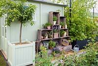Arrangement of wooden boxes storage -'The Perfumer's Garden', RHS Malvern Spring Festival, 2018 - Sponsor: Keyscape Design.