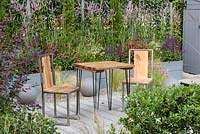 Wood and metal table and chairs. 'Secured by Design', RHS Hampton Flower Show, 2018 
