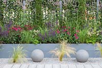 Blue painted raised border set in gravel with stone ball features - Secured by Design, RHS Hampton Court Palace Flower Show 2018
