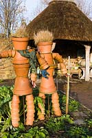 Terracotta pot couple in the Vegetable garden. RHS Garden Rosemoor, Devon, UK.