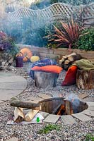 Finished firepit in use in Autumnal setting. 