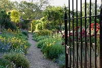 Gateway into walled kitchen garden. Edmondsham House, Cranborne, Dorset, UK
