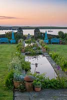 Dawn breaks over the coastal garden at Quoy of Houton, Orkney, unveiling an 18-metre-long rill. 