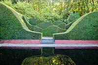  View over the Reflecting Pool to the Hedge Garden. Veddw House Garden, Monmouthshire, Wales, UK.
