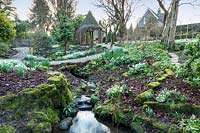 Winter interest flowerbeds. York Gate Garden, Leeds, UK.