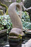Fish sculpture in pond. York Gate Garden, Leeds