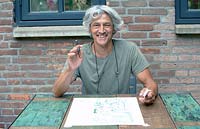 Paul Samuels with sketch of garden design, Netherlands