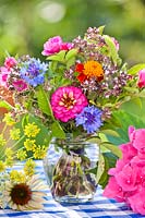 Summer flower bouquet in jar.
