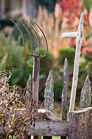 Garden tools - manure fork and scythe.