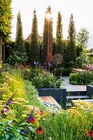 Modern garden with sculpture and seating area. 
Best of Both Worlds garden
RHS Hampton Court Palace Flower Show 2018