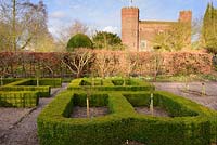 Box parterre with standard roses and gatehoue at Hodsock Priory, Blyth, Nottinghamshire