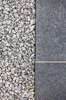 Detail shot of gravel and black basalt tiles. Garden design by John Davies Landscape.