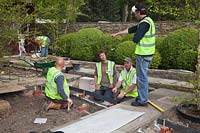 Tom Stuart-Smith with construction team in preparation for RHS Chelsea Flower Show. 