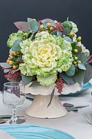 Ornamental cabbage table centrepiece, with Eucalpytus, Hypericum berries and ornamental cabbages.