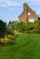 Lawn borders at Thundridge Hill House Garden, Hertfordshire, UK