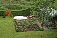 Back garden with small vegetable and cutting garden. 