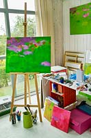 Freda Waldapfel's art studio with painting in progress on easel. 