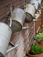 Watering cans ready for use - vintage tools.