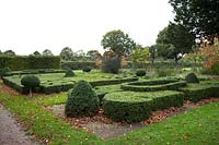 Box edging clipped into topiary shapes and knot patterns at Castle Bromwich Hall Gardens, UK.
