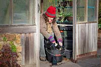 Tidying the greenhouse and washing pots in winter