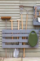 Pallet storage organiser, split painted pallet used for storing tools and gardening equipment. 