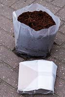 Compressed coconut fibre compost  - Compressed in packet and after adding water. 