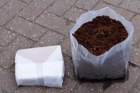 Compressed coconut fibre compost - Compressed in packet and after adding water.
