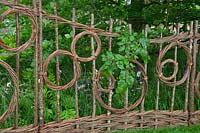Hazel and willow decorative fence in pattern of circles in the show gardenBelmond Enchanted Gardens 