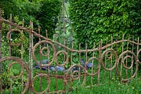 Hazel and willow decorative fence in pattern of circles in the show gardenBelmond Enchanted Gardens 