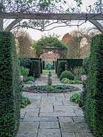 The Rose garden with central ornamental sundial. 