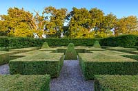 A geometric Box topiary garden. Walcott House, Norfolk, UK.