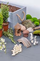 Ingredients and tools for planting up a decorative Easter box. 